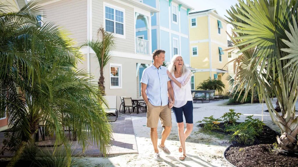 Happy couple walking together outside at Magaritaville Cottages Orlando